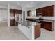 Kitchen with dark cabinetry, granite countertops, and stainless steel appliances at 8817 W Denton Ln, Glendale, AZ 85305