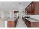 Bright kitchen featuring a large island, stainless appliances, and ample storage at 8817 W Denton Ln, Glendale, AZ 85305