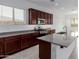 Close up of the modern kitchen showcasing granite counters and stainless appliances at 8817 W Denton Ln, Glendale, AZ 85305