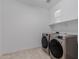 Laundry room featuring modern washer and dryer at 8817 W Denton Ln, Glendale, AZ 85305
