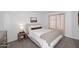 Comfortable bedroom featuring neutral decor, soft lighting, and a king-size bed at 9419 E Riviera Dr, Scottsdale, AZ 85260