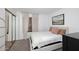 Cozy bedroom featuring a comfortable bed, soft lighting, and a mirrored closet at 9419 E Riviera Dr, Scottsdale, AZ 85260