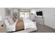 Bright bedroom featuring a sliding glass door, and a modern dresser at 9419 E Riviera Dr, Scottsdale, AZ 85260