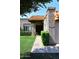 Inviting front entrance with well-maintained landscaping, pathway, and a terracotta tiled roof, offering great curb appeal at 9419 E Riviera Dr, Scottsdale, AZ 85260