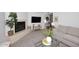 Open living room featuring a fireplace, mounted television, and modern furniture at 9419 E Riviera Dr, Scottsdale, AZ 85260