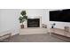 Cozy living room with tiled fireplace, decorative tiles, and modern mantle at 9419 E Riviera Dr, Scottsdale, AZ 85260