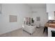 Bright living room with high ceilings, tile floors, and modern furniture at 9419 E Riviera Dr, Scottsdale, AZ 85260