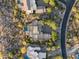 Stunning aerial view of the expansive desert estate with lush landscaping, a private pool, and mountain views at 9894 E Miramonte Dr, Scottsdale, AZ 85262