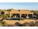 Luxury backyard with pool, outdoor kitchen, and covered patio, perfect for entertaining and enjoying the desert scenery at 9894 E Miramonte Dr, Scottsdale, AZ 85262
