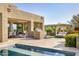 Backyard with pool, outdoor kitchen, lounge area, and dining area create the perfect outdoor entertaining space at 9894 E Miramonte Dr, Scottsdale, AZ 85262