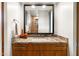 Granite countertop and wood cabinets in a brightly lit bathroom with modern finishes at 9894 E Miramonte Dr, Scottsdale, AZ 85262
