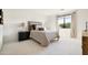 Light and airy bedroom with neutral tones, a large window, and comfortable furnishings at 9894 E Miramonte Dr, Scottsdale, AZ 85262