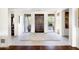 Spacious foyer featuring a modern front door, stylish rug, and ample natural light at 9894 E Miramonte Dr, Scottsdale, AZ 85262