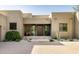 Modern desert home with well-maintained landscaping, decorative gravel, and a contemporary front entrance at 9894 E Miramonte Dr, Scottsdale, AZ 85262