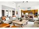 Cozy living room with an open floor plan, comfortable seating, and a view of the modern kitchen at 9894 E Miramonte Dr, Scottsdale, AZ 85262