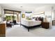 Spacious main bedroom with natural light, a sitting area with an outdoor view and a modern design at 9894 E Miramonte Dr, Scottsdale, AZ 85262