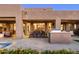 Elegant patio featuring an outdoor dining area, barbecue, and pool with desert landscaping at 9894 E Miramonte Dr, Scottsdale, AZ 85262