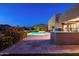 Secluded pool area featuring an outdoor kitchen, lush desert landscape, and tranquil desert vista at 9894 E Miramonte Dr, Scottsdale, AZ 85262