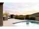 Inviting pool area with desert landscape, outdoor lounge, and mountain views for relaxing and entertaining at 9894 E Miramonte Dr, Scottsdale, AZ 85262