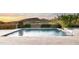 Beautiful pool with mountain views and desert landscaping, perfect for relaxing and enjoying the outdoors at 9894 E Miramonte Dr, Scottsdale, AZ 85262