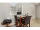 Cozy dining area bathed in natural light, complete with seating for four at 10502 W Bronco Trl, Peoria, AZ 85383