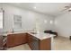 Open-concept kitchen with a view to the living room, featuring a kitchen island at 10502 W Bronco Trl, Peoria, AZ 85383