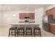 A modern kitchen with wooden cabinets and stainless steel appliances at 10502 W Bronco Trl, Peoria, AZ 85383