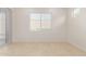A simple empty living room with tile floors at 10502 W Bronco Trl, Peoria, AZ 85383