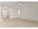 A simple living room features a tiled floor and views of the entry at 10502 W Bronco Trl, Peoria, AZ 85383