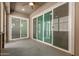 Covered patio with multiple sliding glass doors, providing easy access to the backyard at 10502 W Bronco Trl, Peoria, AZ 85383
