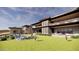 Stunning modern home with a spacious backyard, pool, lounge chairs, and mountain views at 10772 E Canyon Cross Way, Scottsdale, AZ 85255