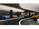 Spacious garage with sleek black ceiling, recessed lighting, and multiple luxury sports cars at 10772 E Canyon Cross Way, Scottsdale, AZ 85255