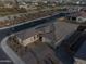 Aerial view showcases the property's well-manicured landscaping, putting green, and desirable neighborhood location at 11019 E Tiburon Ave, Mesa, AZ 85212