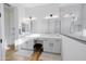 Bathroom featuring a dual vanity, walk-in shower, and neutral tiling at 11019 E Tiburon Ave, Mesa, AZ 85212