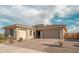 Charming single-story home with a well-maintained front yard and a paver driveway leading to an attached two-car garage at 11019 E Tiburon Ave, Mesa, AZ 85212