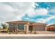 Charming single-story home with a well-maintained front yard and a paver driveway leading to an attached two-car garage at 11019 E Tiburon Ave, Mesa, AZ 85212
