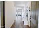 Bright and inviting foyer with tiled floors, a modern bench, and a full-length mirror at 11019 E Tiburon Ave, Mesa, AZ 85212