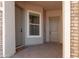 Inviting front porch with stylish doormats, neutral tones, and brick accents creating a warm welcome at 11019 E Tiburon Ave, Mesa, AZ 85212