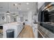 Modern kitchen with a large island, stainless steel appliances, and an open layout connecting to the living area at 11019 E Tiburon Ave, Mesa, AZ 85212