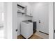 Functional laundry room with modern washer and dryer, storage cabinets, and tiled flooring at 11019 E Tiburon Ave, Mesa, AZ 85212