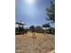 Community playground features swings and shaded structures, perfect for Gathering fun at 11019 E Tiburon Ave, Mesa, AZ 85212