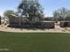 A stone community sign with landscaped features surrounded by manicured green space at 14394 W Calle Lejos --, Surprise, AZ 85387