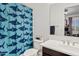 Well-lit bathroom featuring a blue shark themed shower curtain, framed mirror, and white toilet at 1500 E Sagittarius Pl, Chandler, AZ 85249