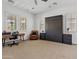 Bright bedroom with a Murphy bed, modern desk, chair, ceiling fan and plantation shutters at 1500 E Sagittarius Pl, Chandler, AZ 85249