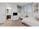 Bright bedroom featuring a TV and vanity adjacent to the en suite bathroom at 1500 E Sagittarius Pl, Chandler, AZ 85249