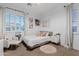 Bright bedroom featuring a full sized bed, accent chair, ceiling fan and plantation shutters at 1500 E Sagittarius Pl, Chandler, AZ 85249