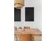 Dining table with decor, set beneath a modern chandelier and framed by black abstract art pieces at 1500 E Sagittarius Pl, Chandler, AZ 85249