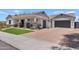 Charming single-story home boasts a well-manicured lawn and a spacious driveway at 1500 E Sagittarius Pl, Chandler, AZ 85249