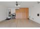 Spacious garage with epoxy floor, utility closet, and large built-in storage cabinets for organization at 1500 E Sagittarius Pl, Chandler, AZ 85249