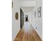 Long hallway with wood floors and modern decor at 1500 E Sagittarius Pl, Chandler, AZ 85249